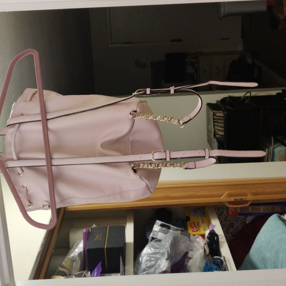 Baby pink leather Victoria Secret draw string backpack with gold chain detail